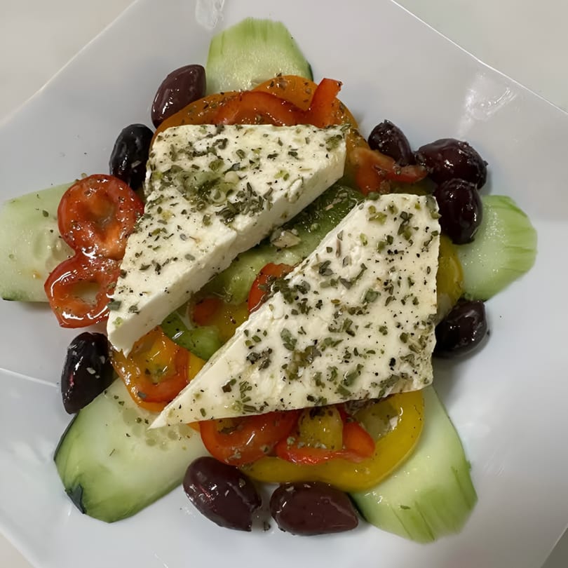 Fabio's Pizzeria & Restaurant's Greek salad with feta, olives, cucumbers, and bell peppers.
